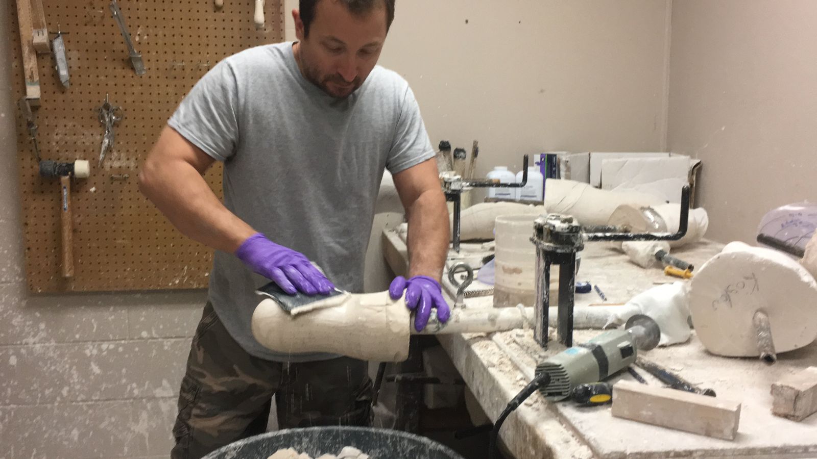 Jamie working on building a leg at the lab